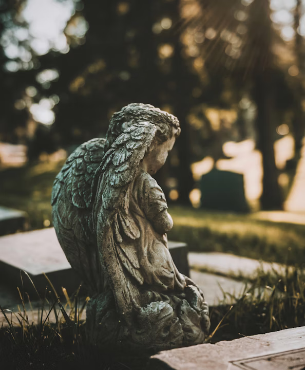 Angel statue in a peaceful cemetery setting